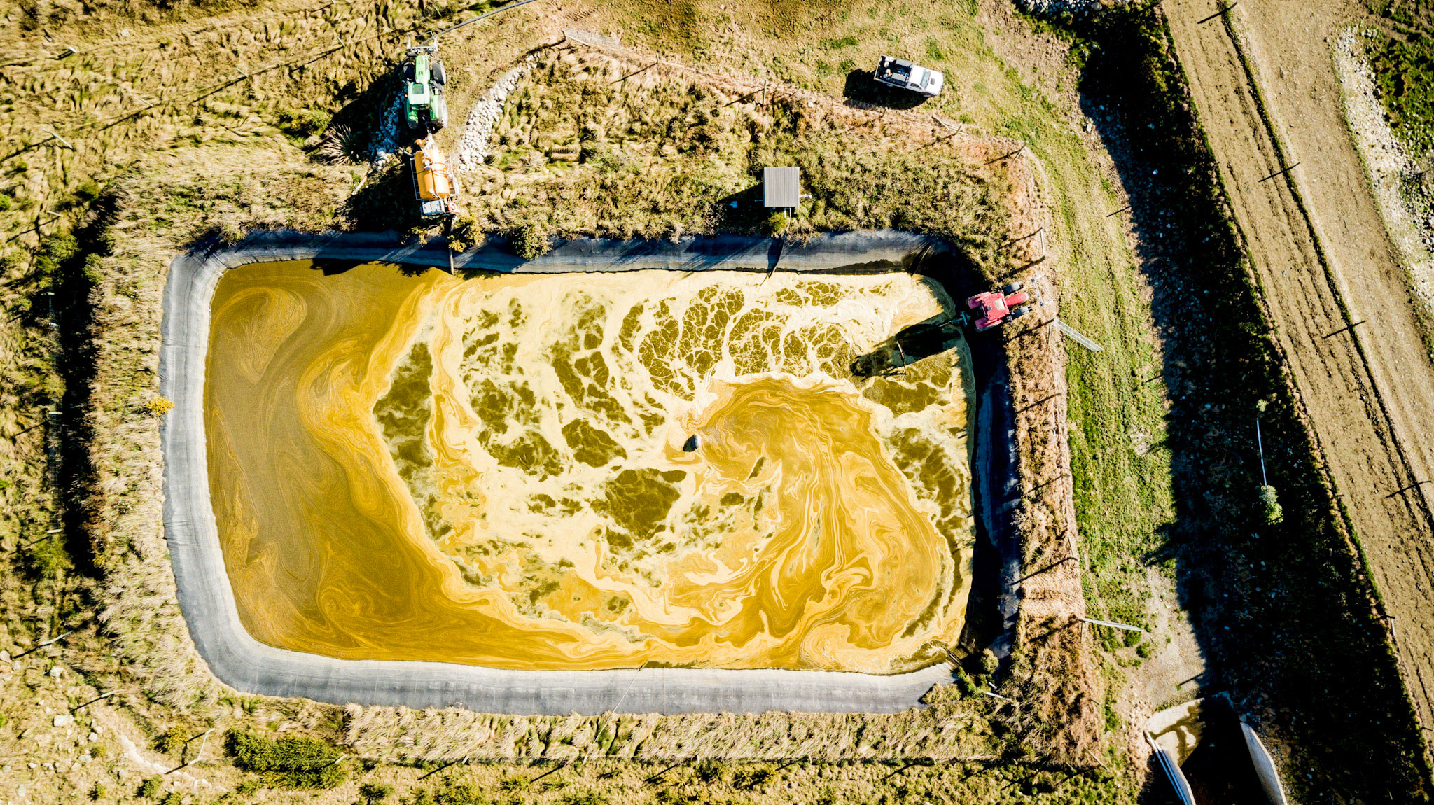 Large slurry pond from above. Farm Slurry